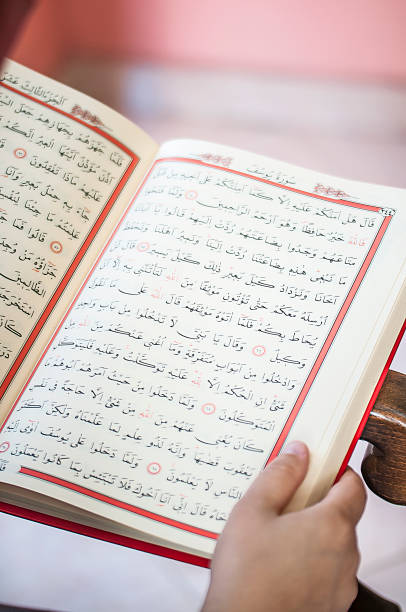 istock Young woman reading the Holy Qur'an 691437608