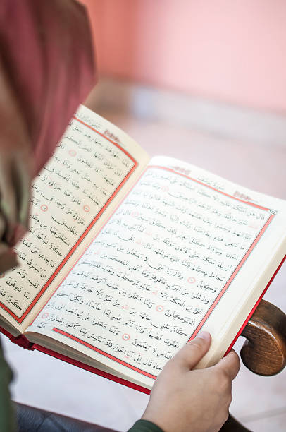 istock Young woman reading the Holy Qur'an 691438348