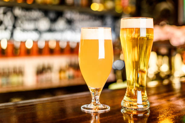 istock A two Glass of light beer on a pub with bokeh background 691438368