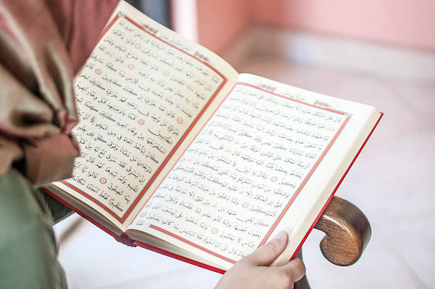 istock Young woman reading the Holy Qur'an 691440104