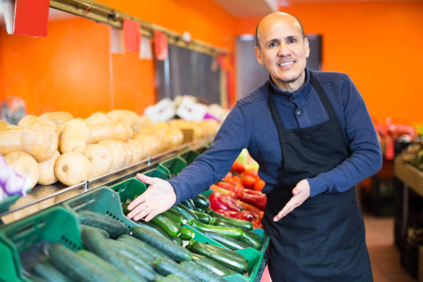 istock Salesman posing near different vegetables 691441540