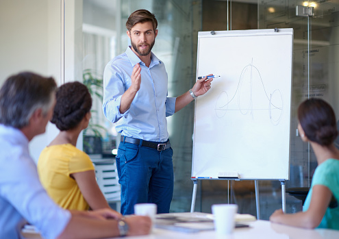 Cropped shot of a handsome young man giving a business presentation