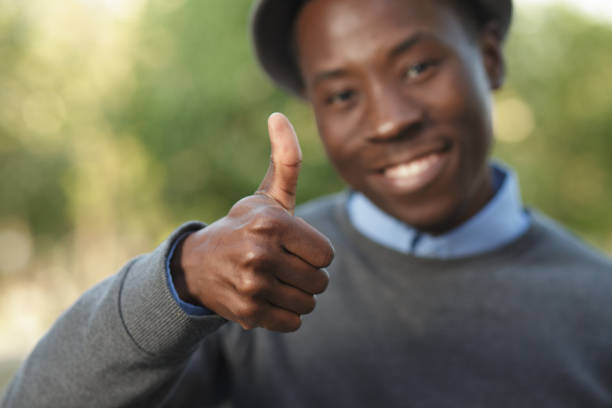 istock African american man in hat giving thumbs up 691444900