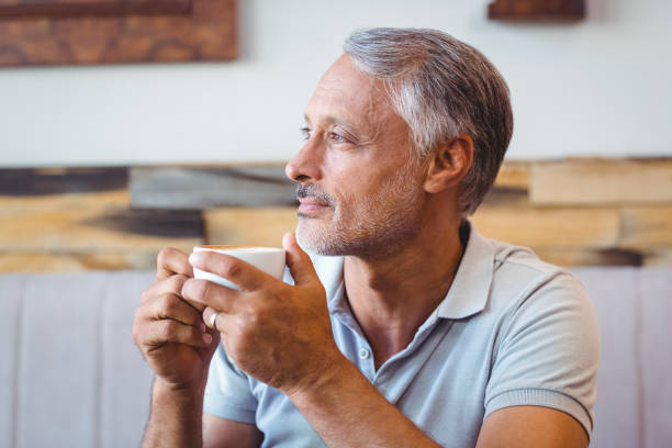 istock Man sitting in cafe having coffee 691449356
