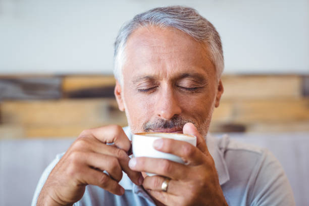 istock Man sitting in cafe having coffee 691449380