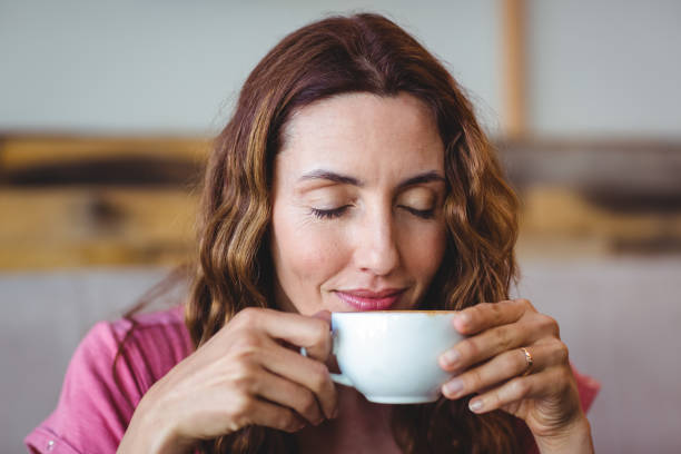 istock Young woman having a coffee 691449438