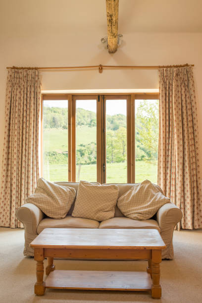 istock Couch and Coffee Table in Front of Patio Doors 691449592