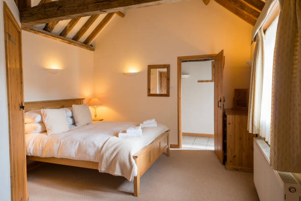 istock Brightly-Lit Fully Furnished Vacation Cottage Bedroom Interior 691449608