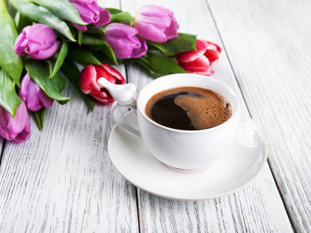 istock cup of coffee with tulips 691452698