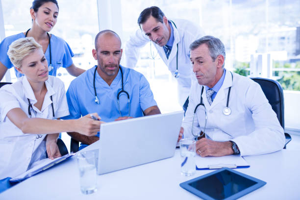istock Teams of doctors working on laptop computer 691452794