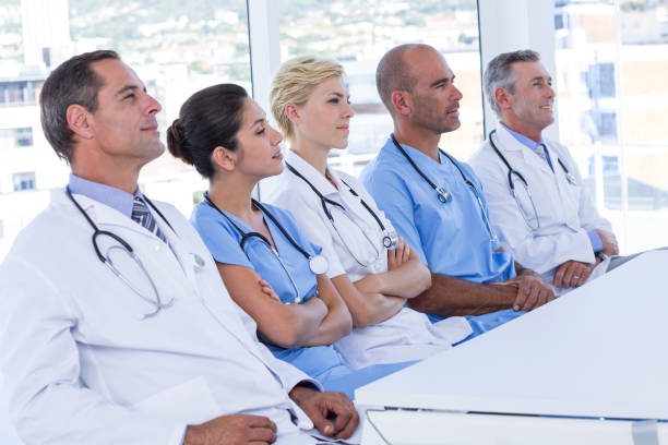 istock Team of doctors listening during meeting 691453042