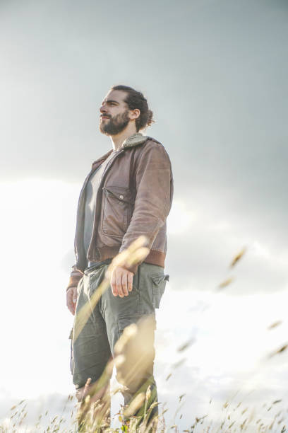 istock Handsome man in the wild nature 691455566
