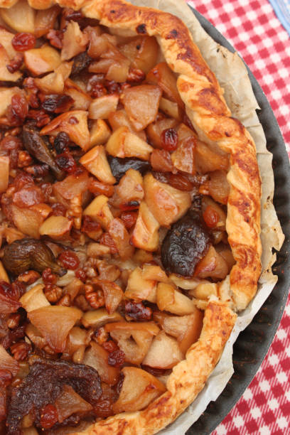istock Alsatian tart with fruits: Apple walnut raisin 691455842