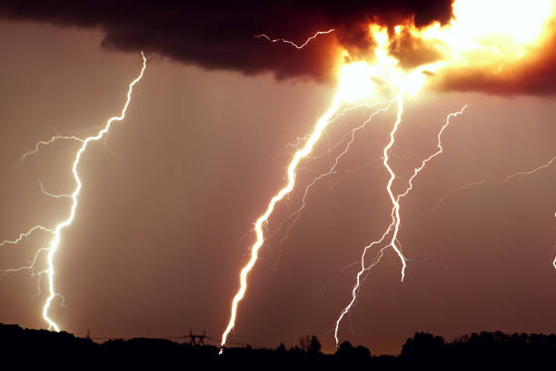 istock Clouds and thunder lightnings and storm on the dark cloudy sky 691455870