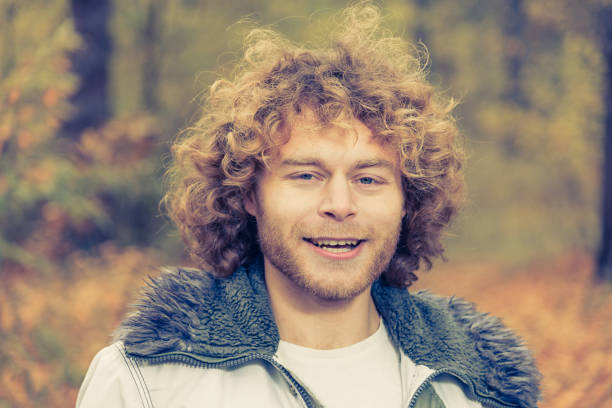 istock Portrait. Curly guy. Emotions joy. 691456886