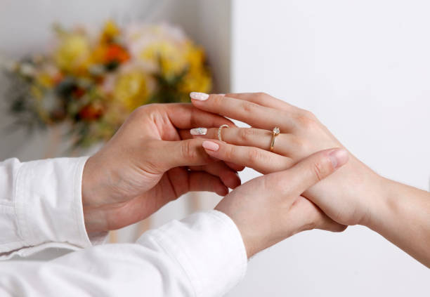 istock Bride wears a wedding ring to the groom 691457094