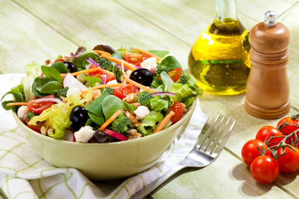 istock Fresh salad plate on green picnic table 691457160
