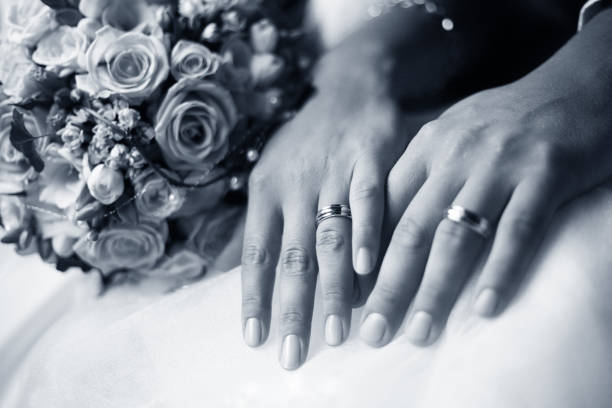 istock Bride wears a wedding ring to the groom 691457202