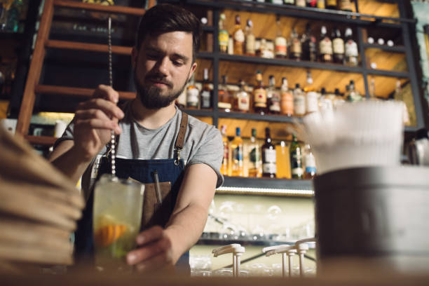istock Young male bartender preparing an alcohol cocktail 691458200