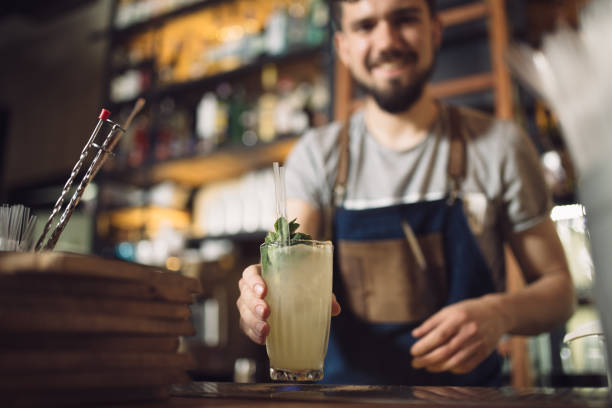 istock Young male bartender preparing an alcohol cocktail 691460480