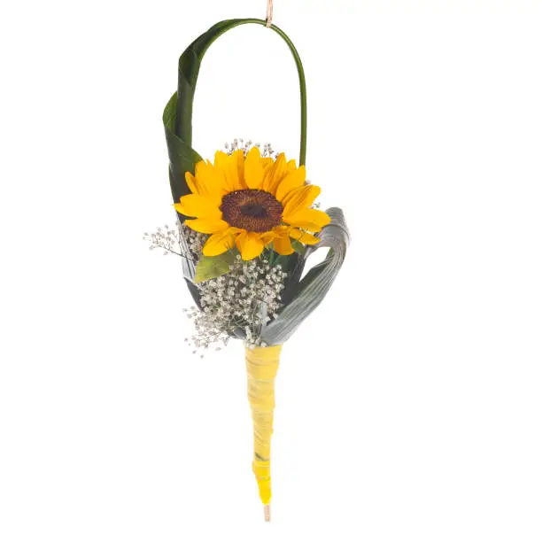 Floreal composition with sunflower and handbag made of aspidistra’s leaf