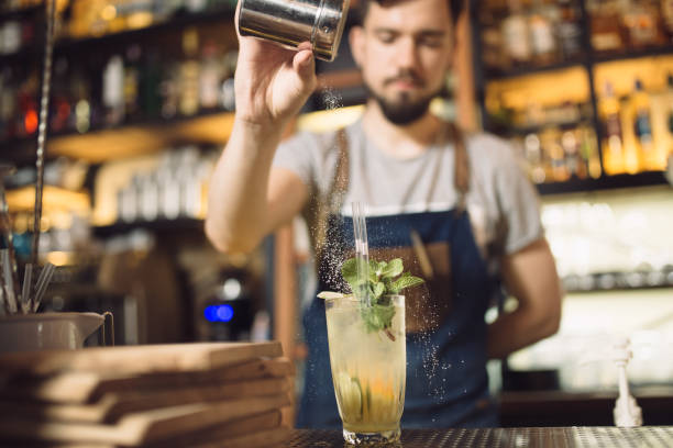 istock Young male bartender preparing an alcohol cocktail 691460942