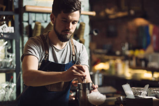 istock Young male bartender preparing an alcohol cocktail 691461664