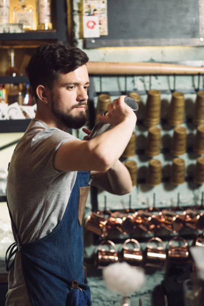 istock Young male bartender preparing an alcohol cocktail 691464206