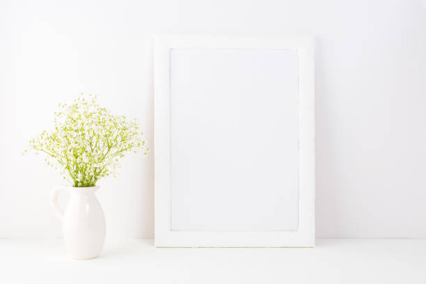 istock White frame mockup with Rue Anemone flowers 691464252