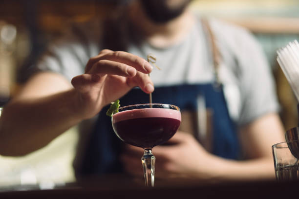 istock Cropped of bartender preparing an alcohol cocktail 691464570