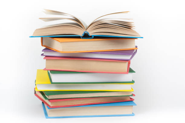 Book stacking. Open book, hardback books on white background. Back to school. Copy space for text stock photo