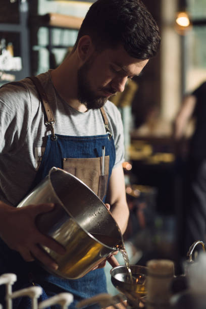 istock Young male bartender preparing an alcohol cocktail 691464910