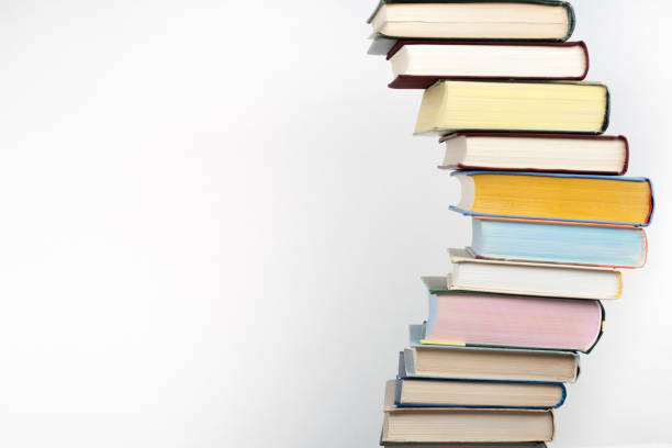 Stack of colorful real books on white background, partial view. Back to school. Copy Space. Education background