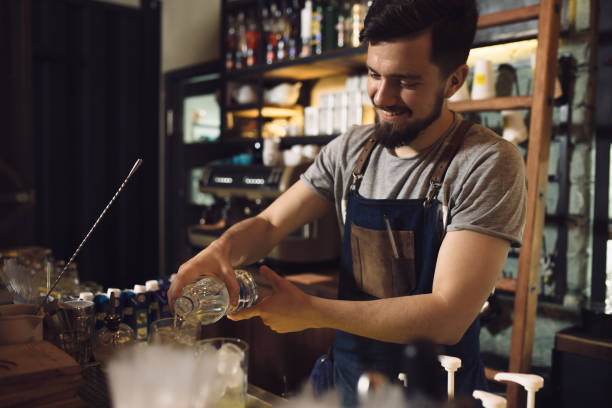 istock Young male bartender preparing an alcohol cocktail 691467206