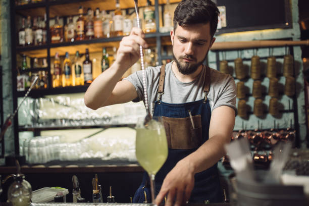 istock Young male bartender preparing an alcohol cocktail 691467670