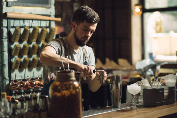 istock Young male bartender preparing an alcohol cocktail 691470784