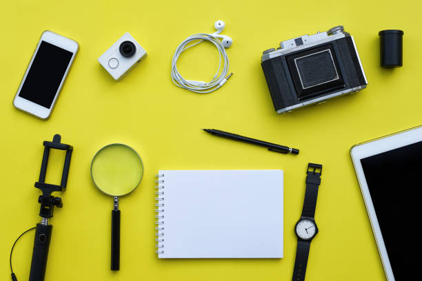 istock Flat lay of accessories on yellow desk background 691471780