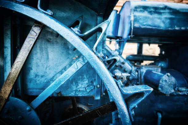Vintage agricultural steel machine. Blue industrial techno background