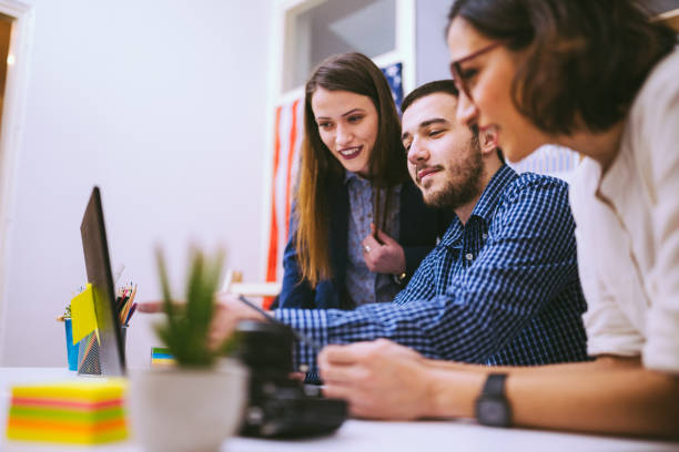 istock Young Man Pointing Among Women At Stuff Meeting 691479312
