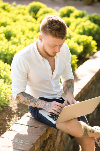 istock Man freelancer working with laptop in a nature 691479788