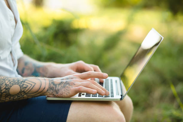 istock Man freelancer working with laptop in a nature 691482570