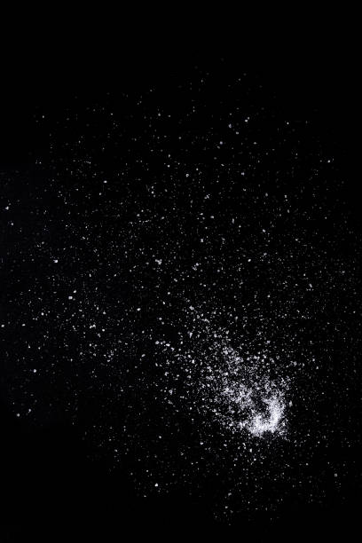 istock Sea salt over black background. 691482866