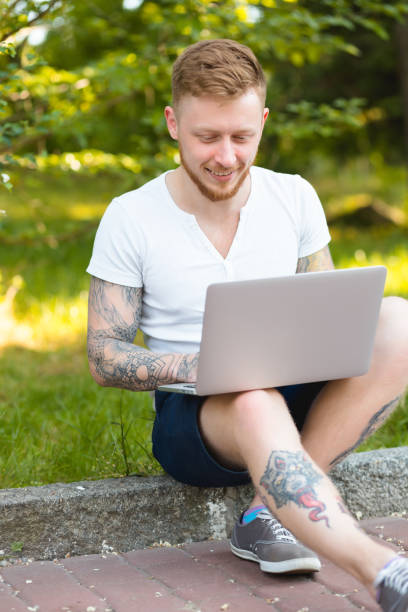 istock Man freelancer working with laptop in a nature 691483372