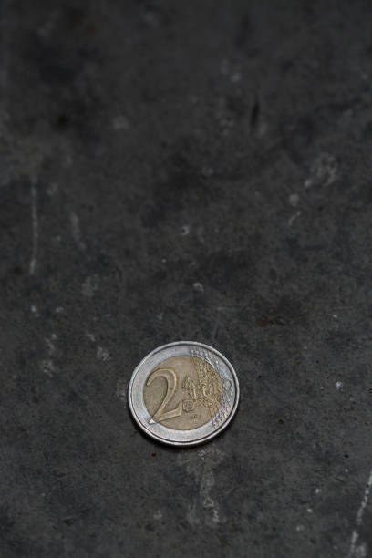 istock 2 euro coin on the floor. 691493144