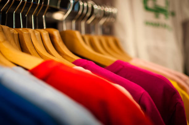 istock Display of colorful hanging t-shirts 691496918