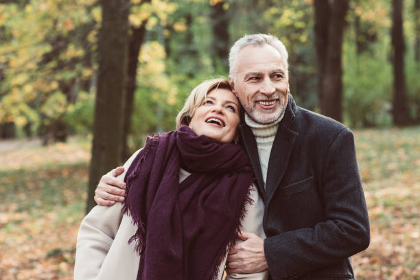istock Smiling mature couple in park 691503500