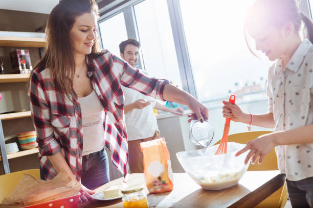 istock mother and daughter cooking together 691503736