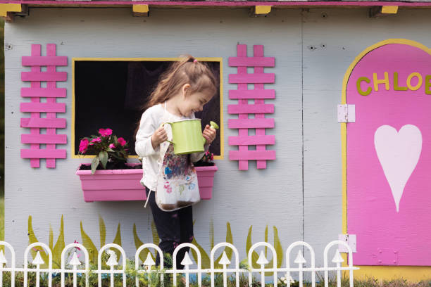 Litte girl gardening with her grandmother