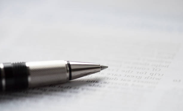 istock Pen on a newspaper, close-up picture 691520262