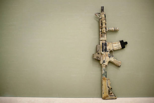 istock Assault Rifle, painted in sand color. 691521212